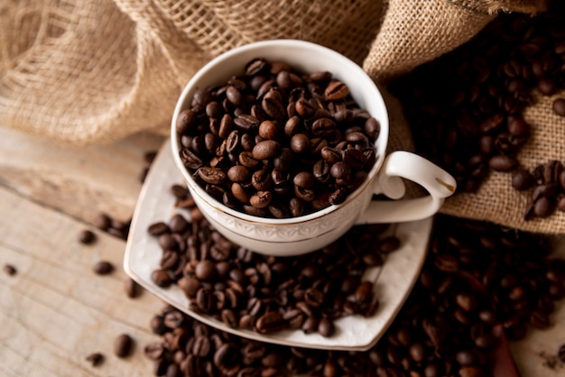 High view cup with coffee beans