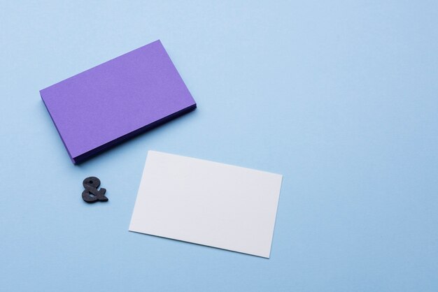 High view empty violet and white business cards