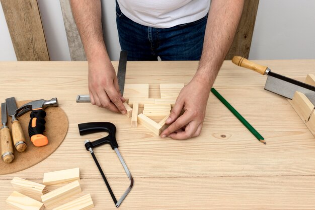 High view hands and wood