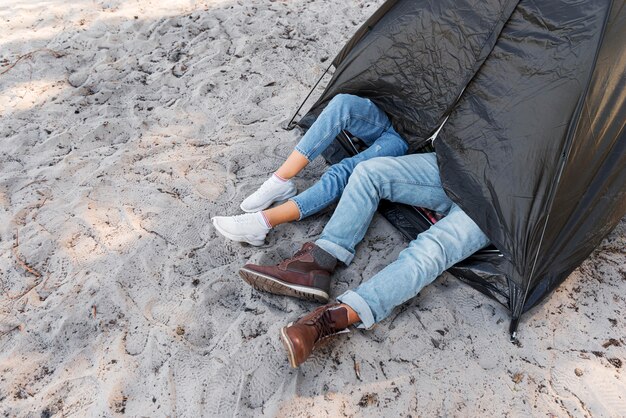 High view legs outside the tent