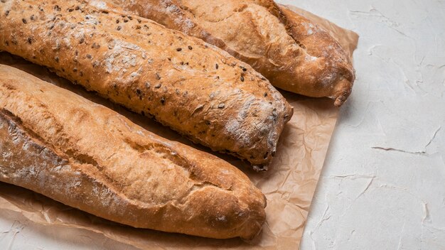 High view loaves of bread on baking paper