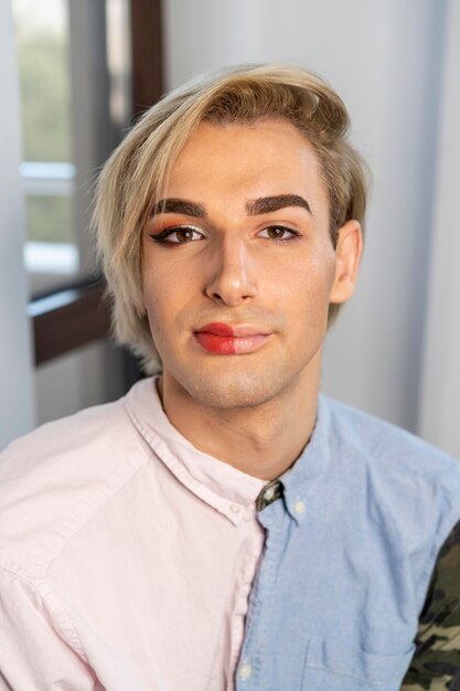 High view man wearing make-up on half his face