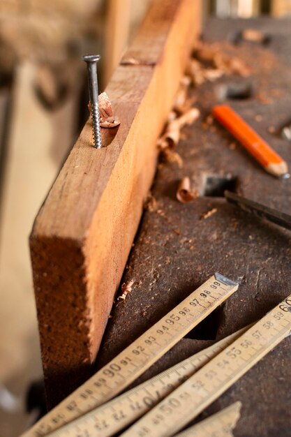 High view nail hammered on wood