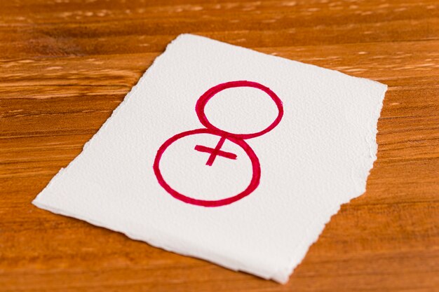 High view paper with number eight and female symbol