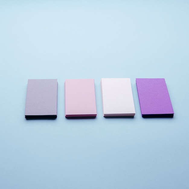 Free photo high view pastel-coloured business cards