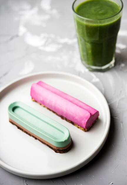 High view plate with eclairs and smoothie