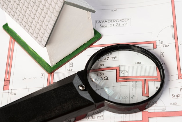 High view real estate plans with magnifying glass