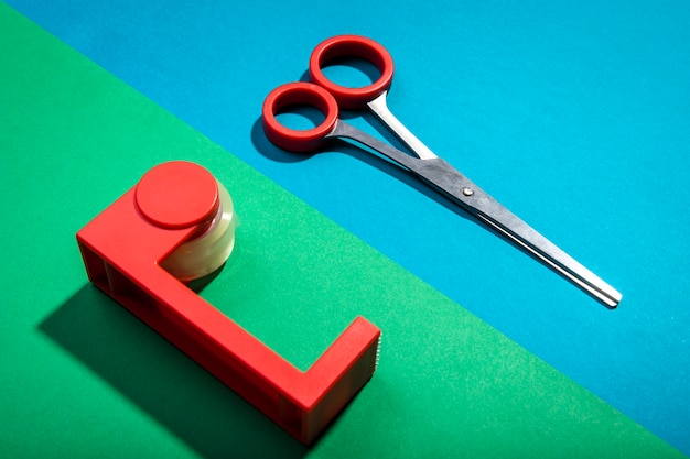 Free photo high view red scissors and stationery desk item