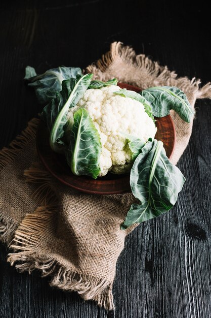 High view shot of cauliflower on a burlap fabric