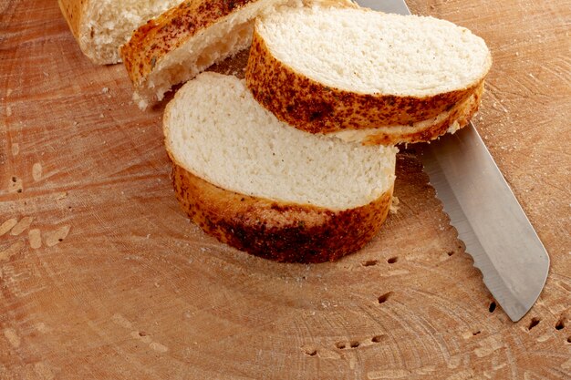 High view of sliced bread and knife