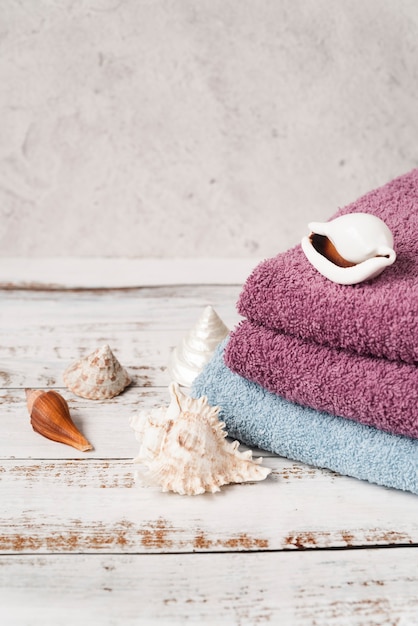 High view stacked towels on wooden table