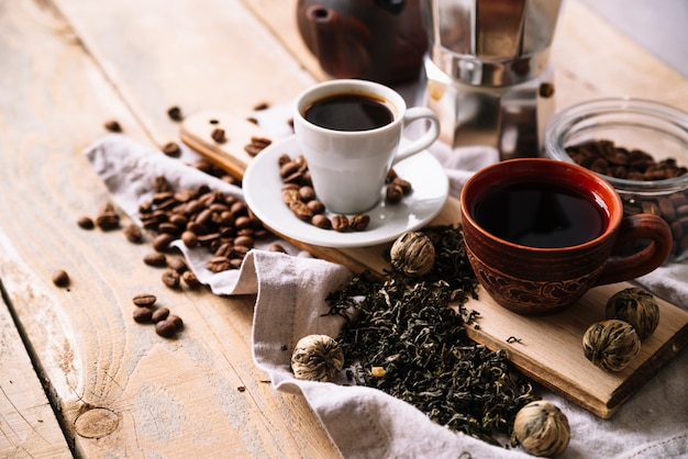 High view variety of tea cups and herbs