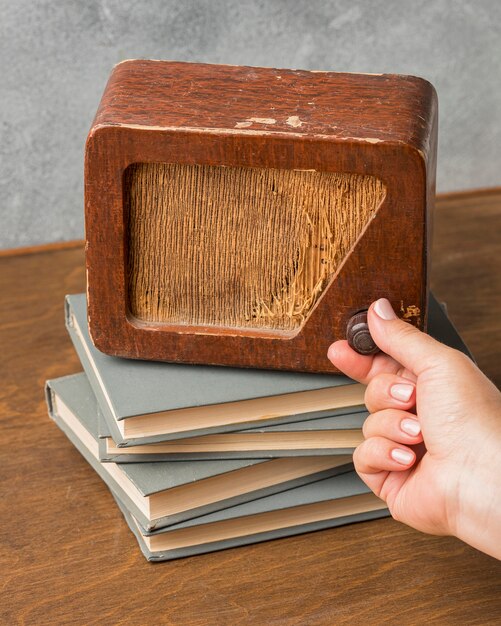 High view vintage radio on pile of books