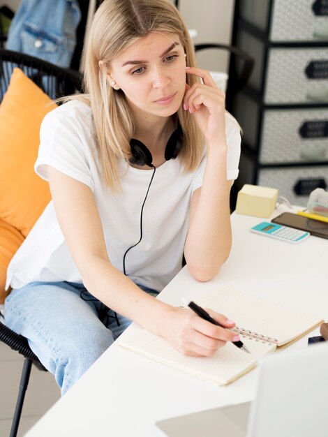 High view woman learning from home