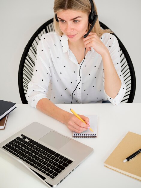 high view woman wearing headphones