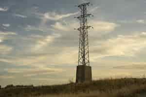 Free photo high voltage electric transmission tower against the sky at sunrise