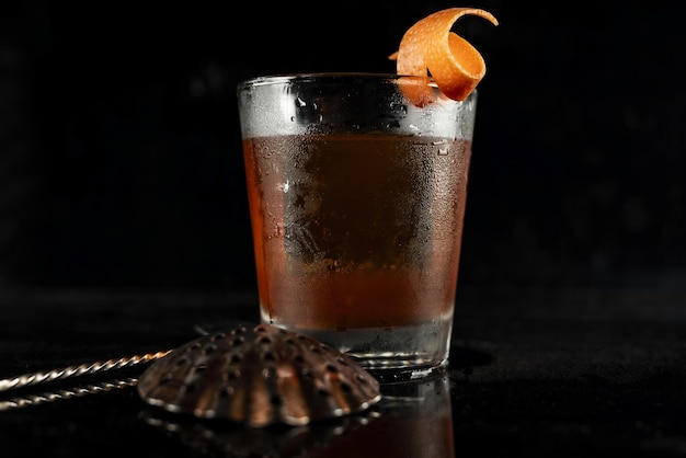 Free photo highend craft cocktail isolated on a black background