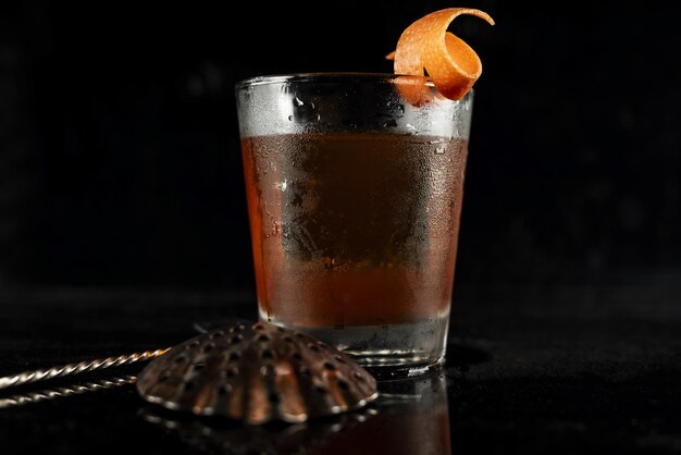 Highend craft cocktail isolated on a black background