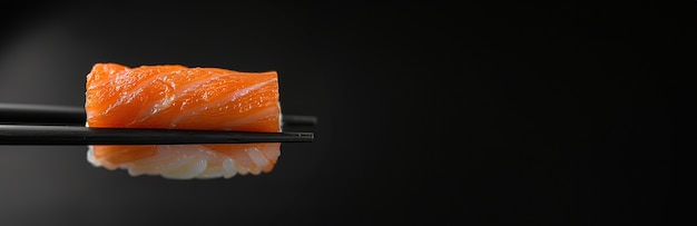 Highly detailed seafood sushi dish with simple black background