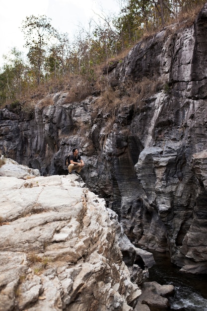 Hiker admiring cliffs