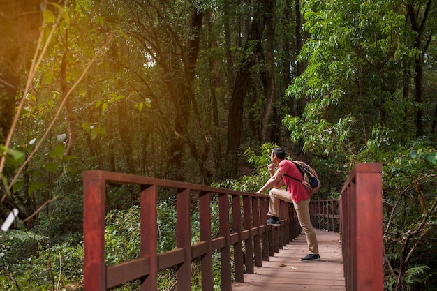 Hiker chilling on old bridge