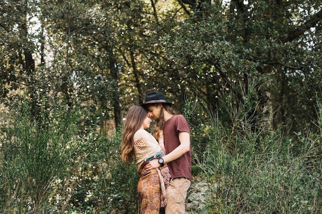 Hiker couple in love kissing in nature