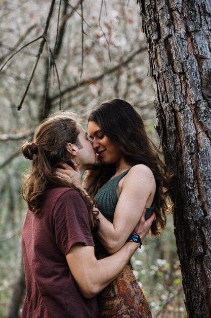 Hiker couple in love kissing in nature