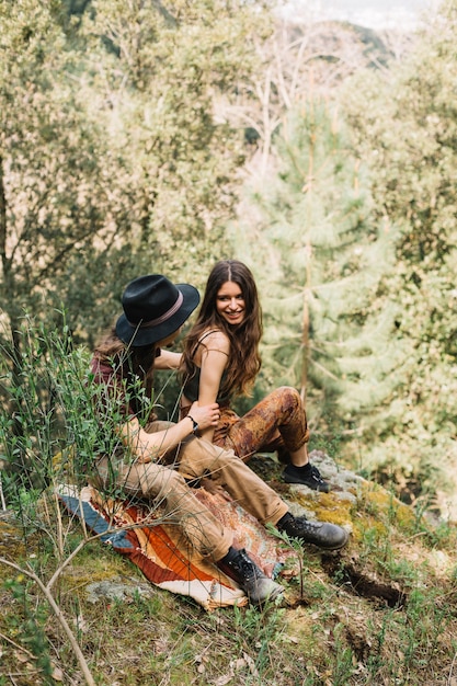 Hiker couple in love sitting in nature