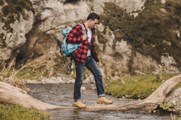 Hiker crossing the river