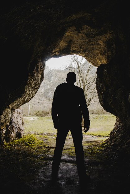 Hiker exploring a cave