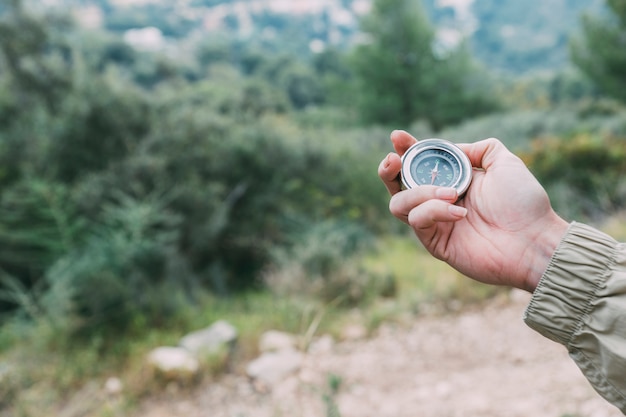 Hiker holding compass