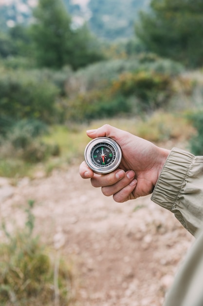 Free photo hiker holding compass