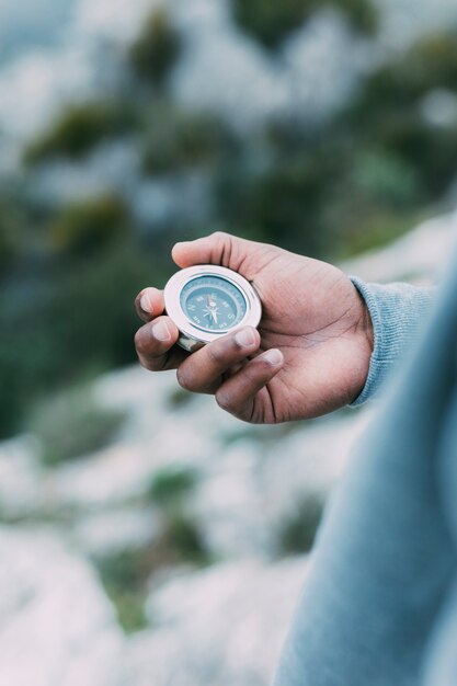 Hiker looking at compass