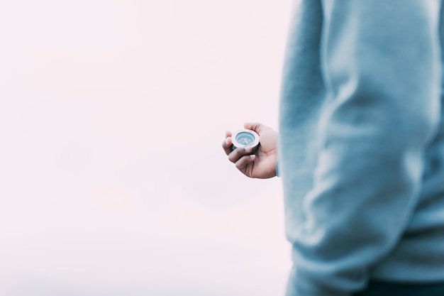 Hiker looking at compass