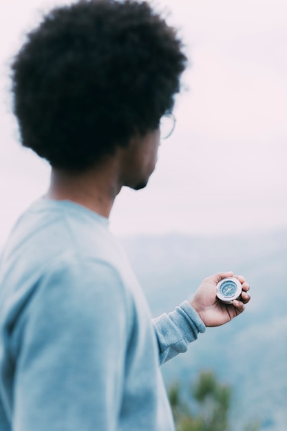 Hiker looking at compass