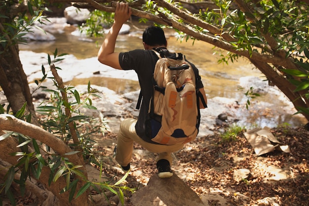 Free photo hiker next to river