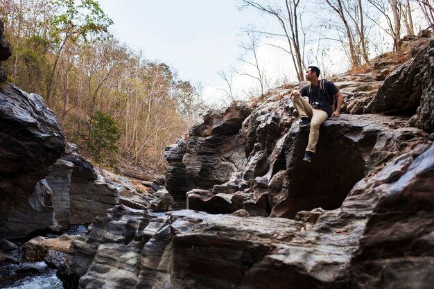 Hiker on rocks near river