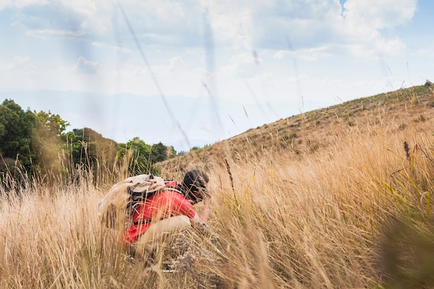 Hiker touching ground