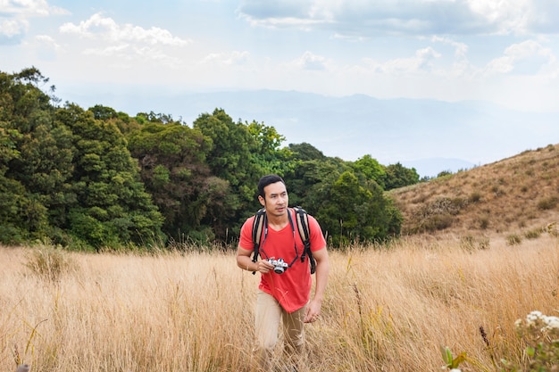 Hiker walking uphill in nature