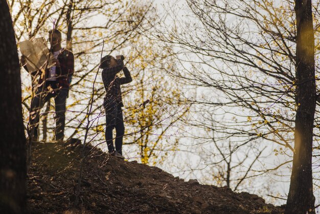 Hikers looking for the road at sunset