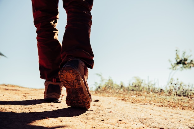 hiking shoes in action on a mountain desert trail path. 