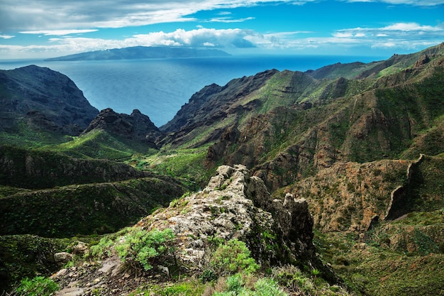 Hill against background of the beautiful mountain landscape