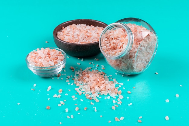 Himalayan salt in bowls and a big jar