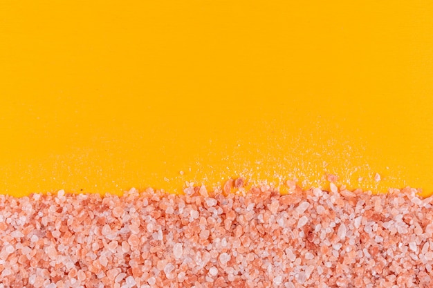 Himalayan salt on orange surface