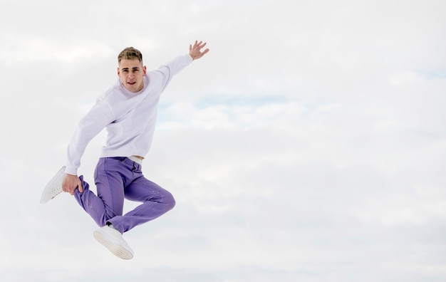 Hip hop performer posing mid-air