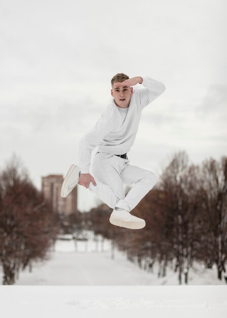 Hip hop performer posing while dancing outside