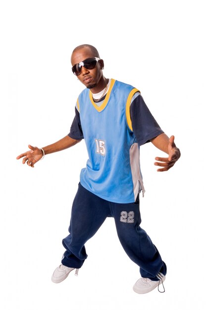 Hip-hop young man making cool move on white background