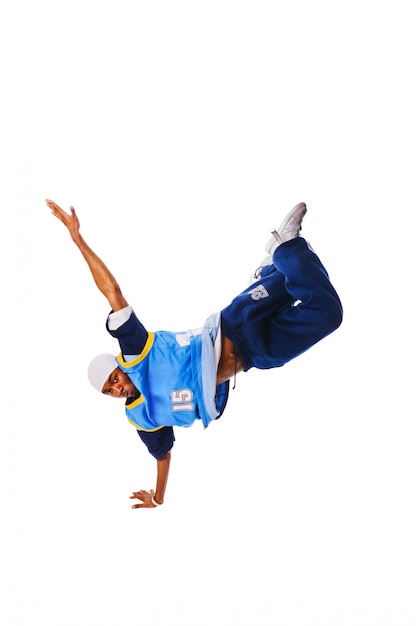 Hip-hop young man making cool move on white background