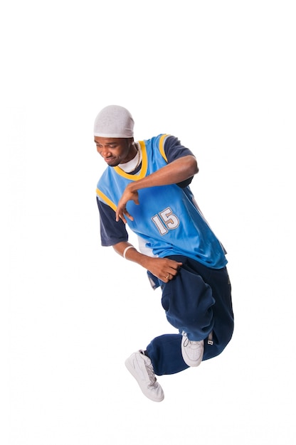 Hip-hop young man making cool move on white background