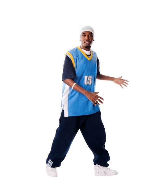 Hip-hop young man making cool move on white background